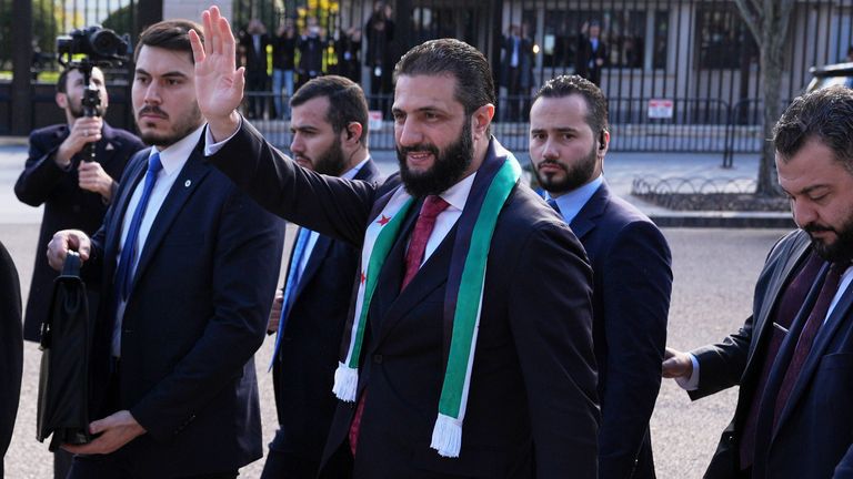 al Sharaa waves as he greets supporters outside the White House. Pics: AP