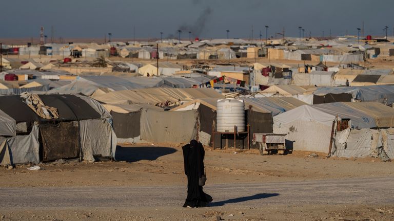 A woman walks in the Al Hol camp, where thousands of Islamic State-linked women and children live. File pic: AP