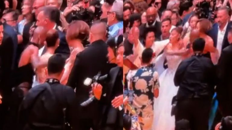 A fan jumped the barrier and rushed at Ariana Grande as she was walking down the yellow carpet at the 'Wicked: For Good' premiere in Singapore.