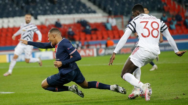 Tuanzebe challenges PSG's Kylian Mbappe during a Champions League match in October 2020. Pic: PA