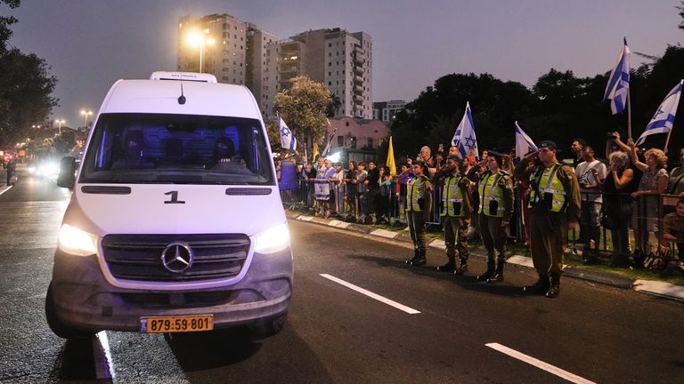 A police convoy carries Hadar Goldin's remains to a facility for forensic checks. Pic: AP
