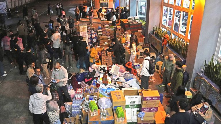 Supplies are brought to a school which is serving as a shelter. Pic: Kyodo/AP