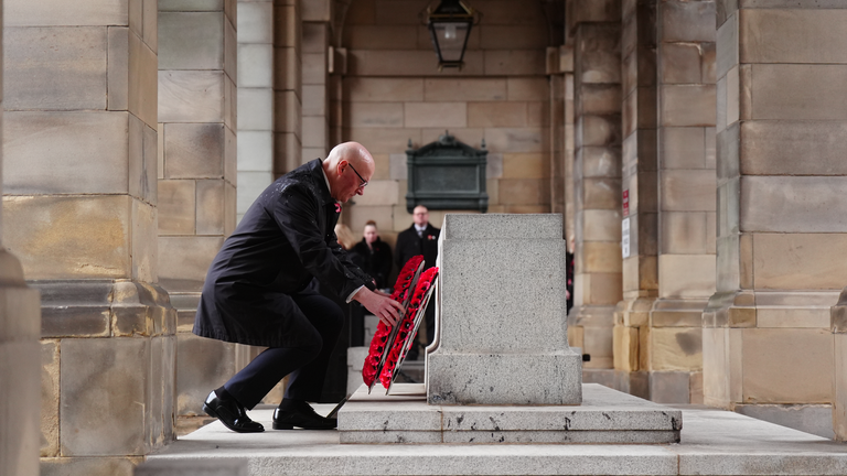 John Swinney, the first minister of Scotland, lays a wreath. Pic: PA