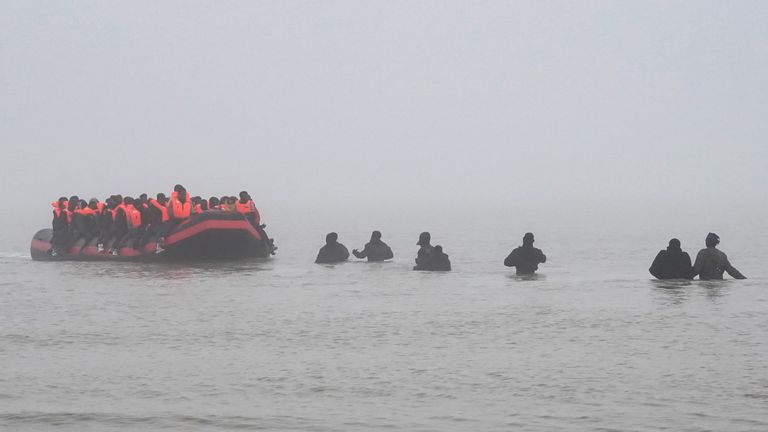 People thought to be migrants board a small boat in Gravelines, France on Friday 7 November. Pic: PA
