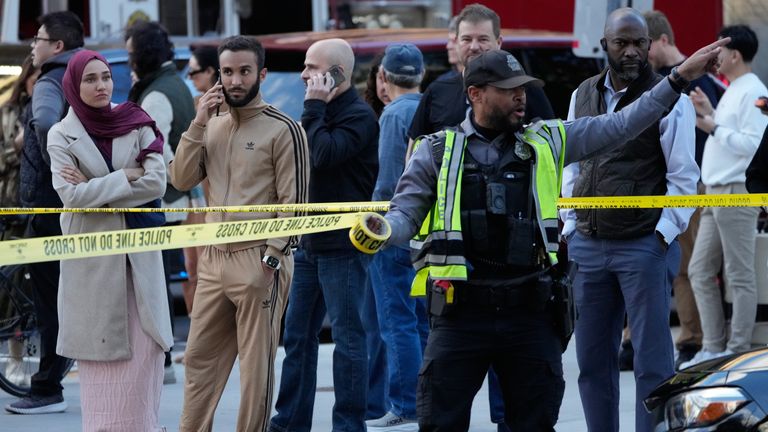 Emergency personnel cordon off an area near where National Guard soldiers were shot. Pics: AP