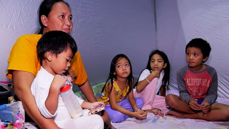 Jennifer Amata fled with her five children and grandchildren to a local university to shelter from the typhoon