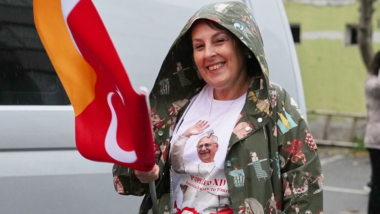 A woman outside the Syriac Orthodox church of Mor Ephrem during Pope Leo XIV's meeting. Pic: AP
