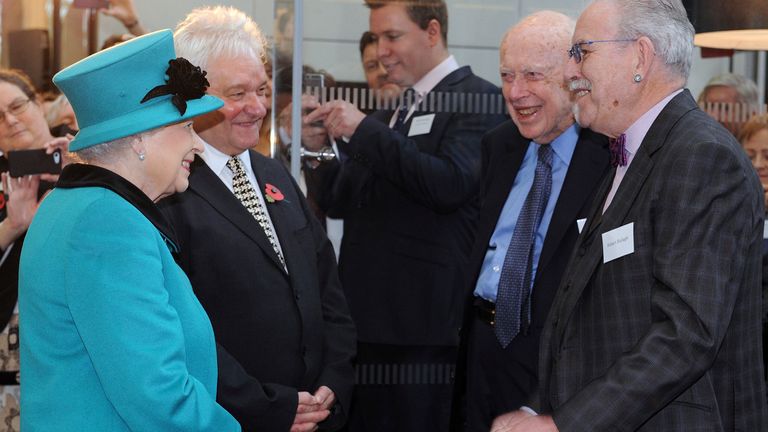 Queen Elizabeth II meets Sir Paul Nurse and James Watson. Pic: AP