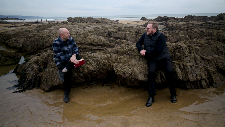 Sky's Data and Forensics correspondent Tom Cheshire interviews Bishop Ceirion Dewar on a beach in Cornwall 