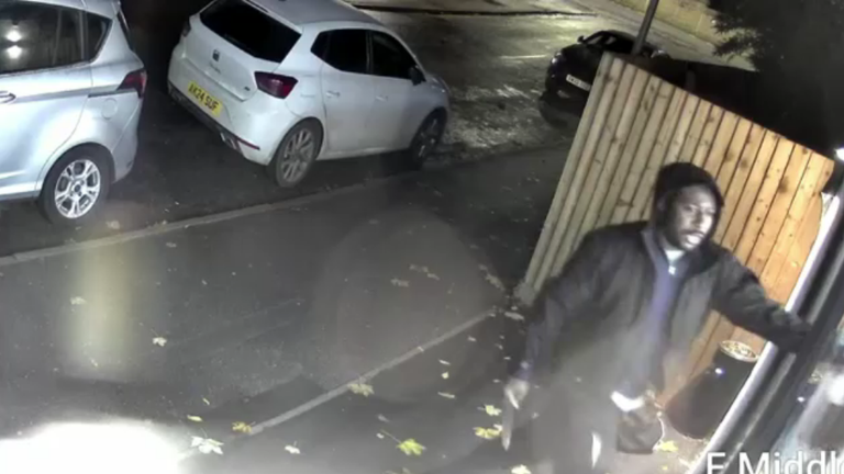 CCTV image of the man entering the shop armed with a knife