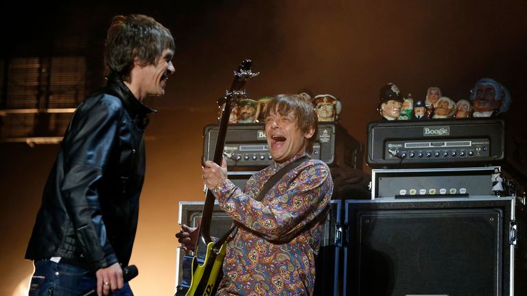 Ian Brown, left, with Mani, right, performing on stage during their 2012 reunion concerts in Manchester. Pic: Reuters