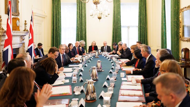 Tim Allan (left, behind the flag) sitting in on a Cabinet meeting, in September. Pic: Number 10/Flickr