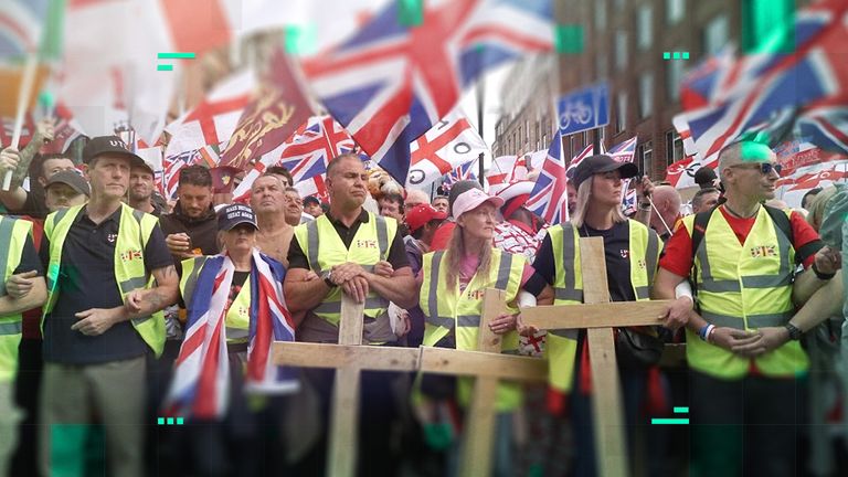 People stand with crucifixes at the Unite the Kingdom rally, in central London on 13 September