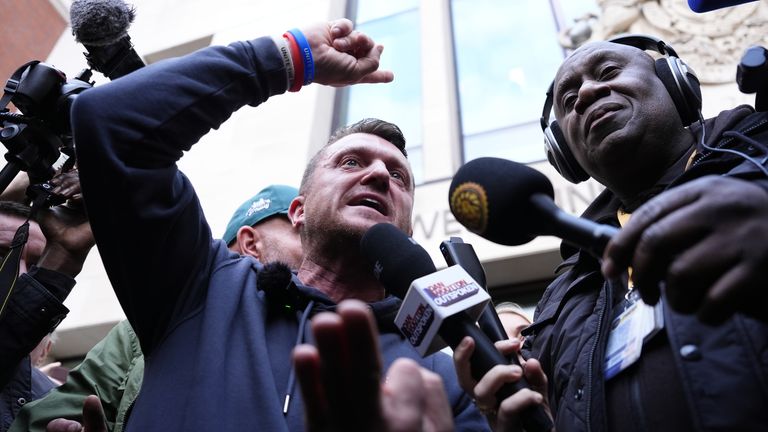 Tommy Robinson speaks to reporters as he leaves court in London. Pic: PA