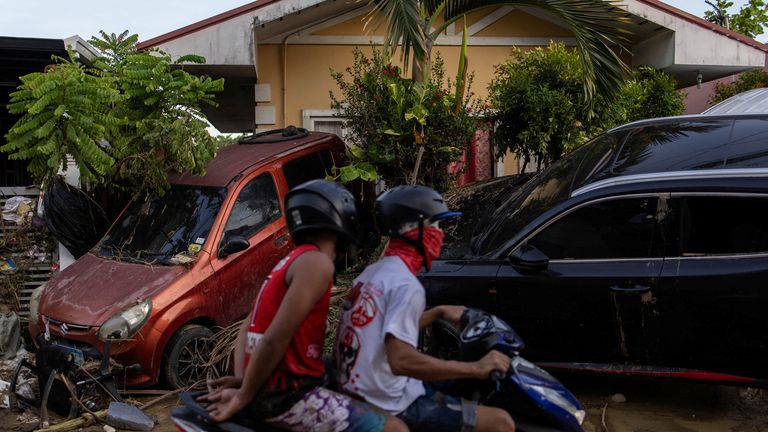 Abandoned vehicles were also seen across Cotcot, in Liloan. Pic: Reuters