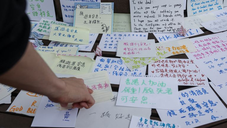 People leave notes with well-wishes after the deadly fire. Pic: Reuters