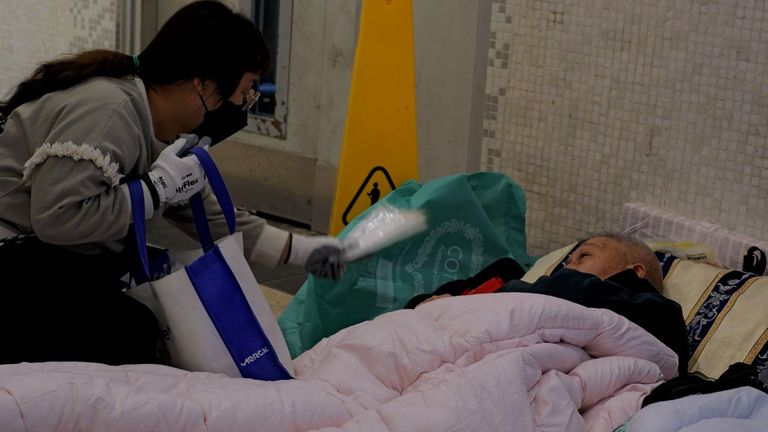 One man opted to sleep on the floor close to his burned-down home