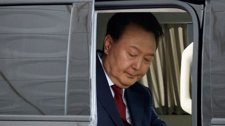 Mr Yoon arrives at the prosecutor's office in Seoul for questioning earlier this year. Pic: Reuters