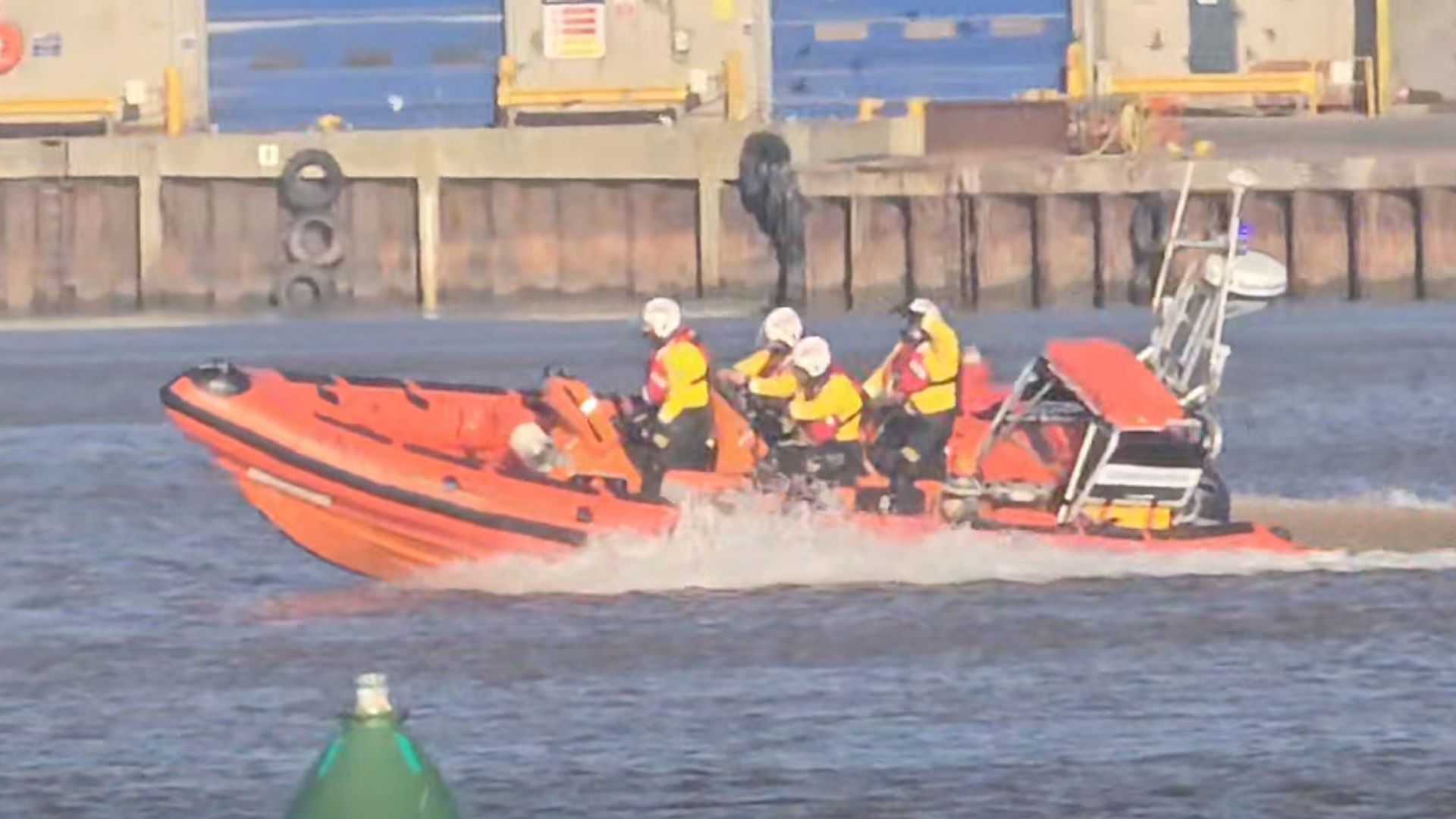 Search for two people in water off beach under way