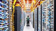 A technician works at an Amazon Web Services AI data center in New Carlisle, Indiana