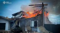 A house burns after it was heavily damaged during Russian early morning drone and missile strikes, amid Russia's attack on Ukraine, in Kyiv 