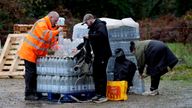 A worker hands out bottled water at the Upper Pantiles car park in Tunbridge Wells.
Pic PA