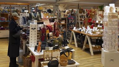 Gurpreet Narwan is seen at the garden centre while being shown how Facewatch works