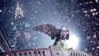 The Chrysler Building stands behind Grand Central Station as snow falls during a winter storm in New York City. Photo: Reuters