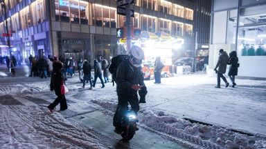 A man rides a unicycle in the snow in New York City. Photo: Reuters