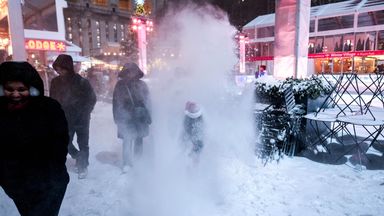 People get hit by snow falling from a snowplow at the Bryant Park Ice Rink in New York City. Photo: Reuters