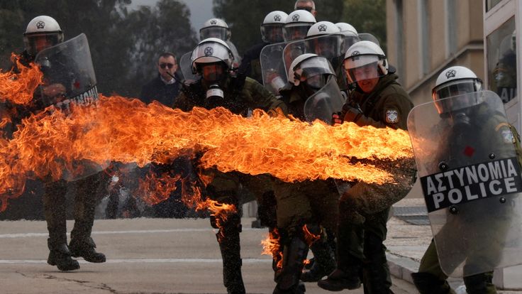 A Molotov cocktail hits a riot police officer during a protest Athens, 28 February. Pic: Reuters