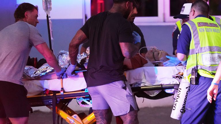 An injured person on a stretcher following the shooting. Pic: AP