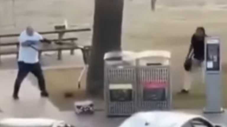 The bystander then points the weapon at the attacker who moves away towards a bridge