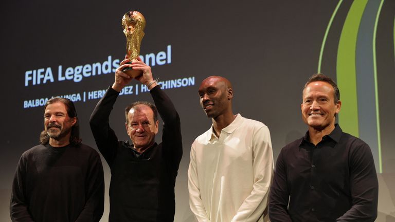 Brazil's Dunga lifts the trophy surrounded by former football legends at a World Cup promotional event in Washington DC on Wednesday. Pic: Reuters