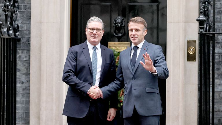 British Prime Minister Keir Starmer greets French President Emmanuel Macron at 10 Downing Street, as E3 partners France, Germany and Britain meet in London, Britain, December 8, 2025. REUTERS/Isabel Infantes