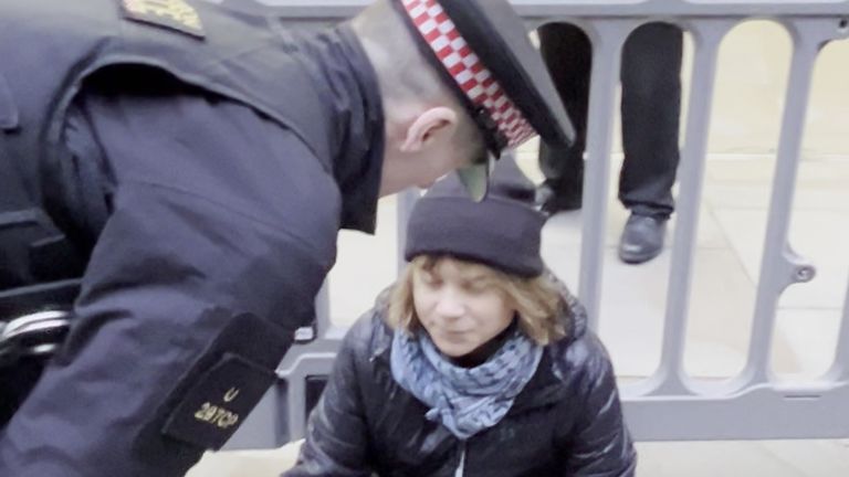 The activist being spoken to by officers from the City of London Police. 
Pic: Prisoners for Palestine/PA