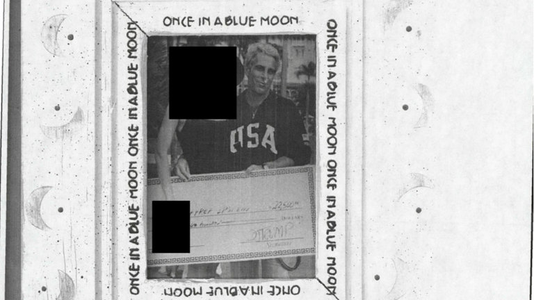 Jeffrey Epstein holding a novelty cheque signed by D. Trump. Pic: US DoJ