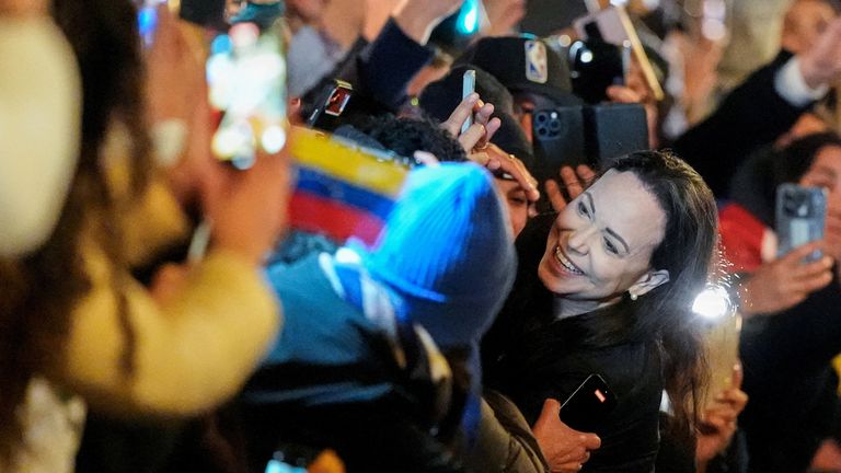 She also greeted jubilant supporters outside. Pics: Reuters