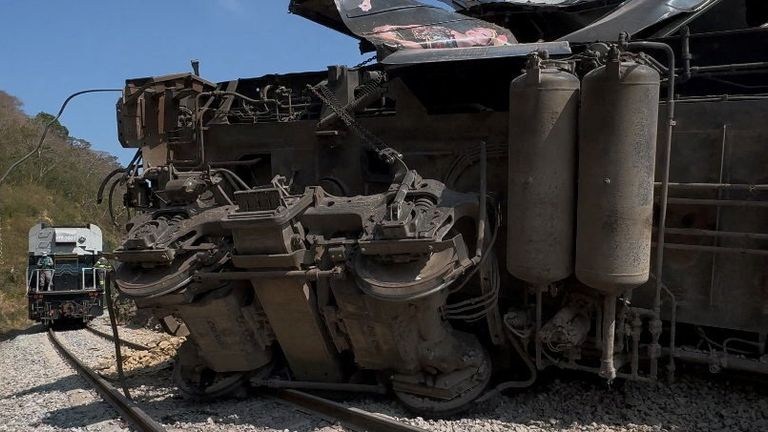 A compartment is overturned at the site of a train derailment in Oaxaca state, Mexico. Pic: Social media video via Reuters