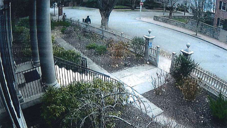 The suspect is seen running away after encountering John again. Pic: Rhode Island Attorney General