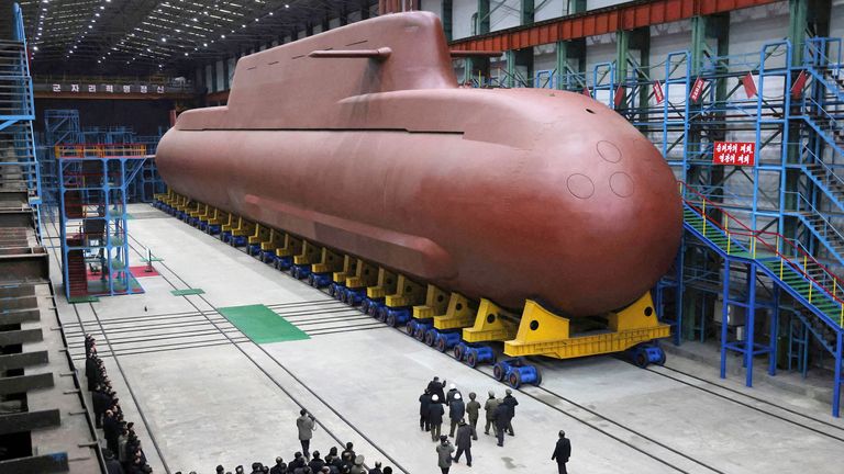 Kim Jong Un visits the construction site of an 8,700-ton nuclear-powered submarine. Pic: KCNA/Reuters