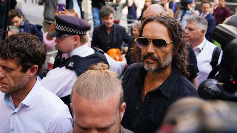 Russell Brand arriving at Westminster Magistrates' Court in May. Pic: PA