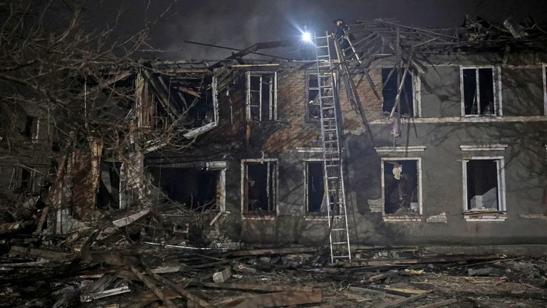 Rescuers work at the site of apartment buildings hit by a Russian airstrike in Sloviansk, Ukraine. Pic: Reuters