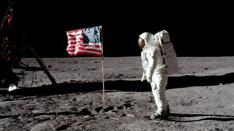 Buzz Aldrin, lunar module pilot for Apollo 11, poses for a photograph beside the deployed US flag in 1969. Pic: Reuters