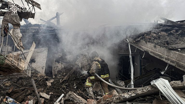 Rescuers work after a Russian air strike in Sumy region, Ukraine. Pic: Reuters