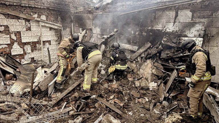 Rescuers work at the site where a shop was hit by a Russian air strike in Sumy. Pic: Emergency Service of Ukraine