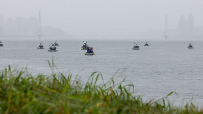 Explosive barrels placed by Taiwan military at the Tamsui river. Pic: Reuters
