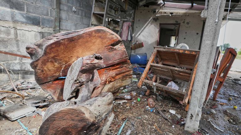 A house which, Thai local security forces say, was damaged by a Cambodian artillery strike in Surin province, Thailand, on 11 December. Pic: AP
