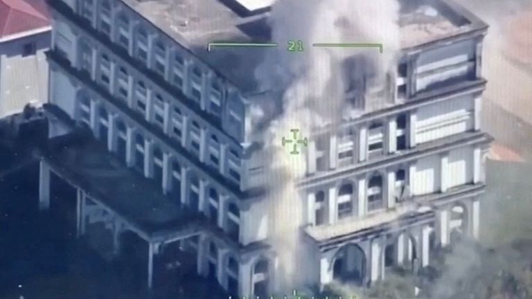 Smoke rises from a building following an explosion near the border between Thailand and Cambodia. Pic: Royal Thai Navy