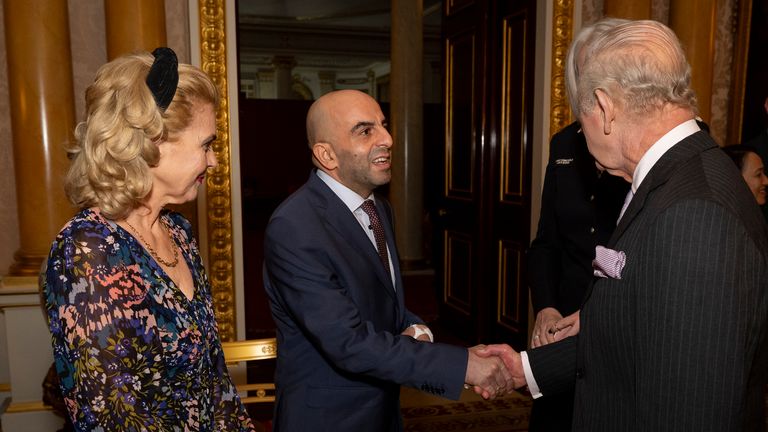The King greets train guard Samir Zitouni during a reception at Buckingham Palace. Pic: PA